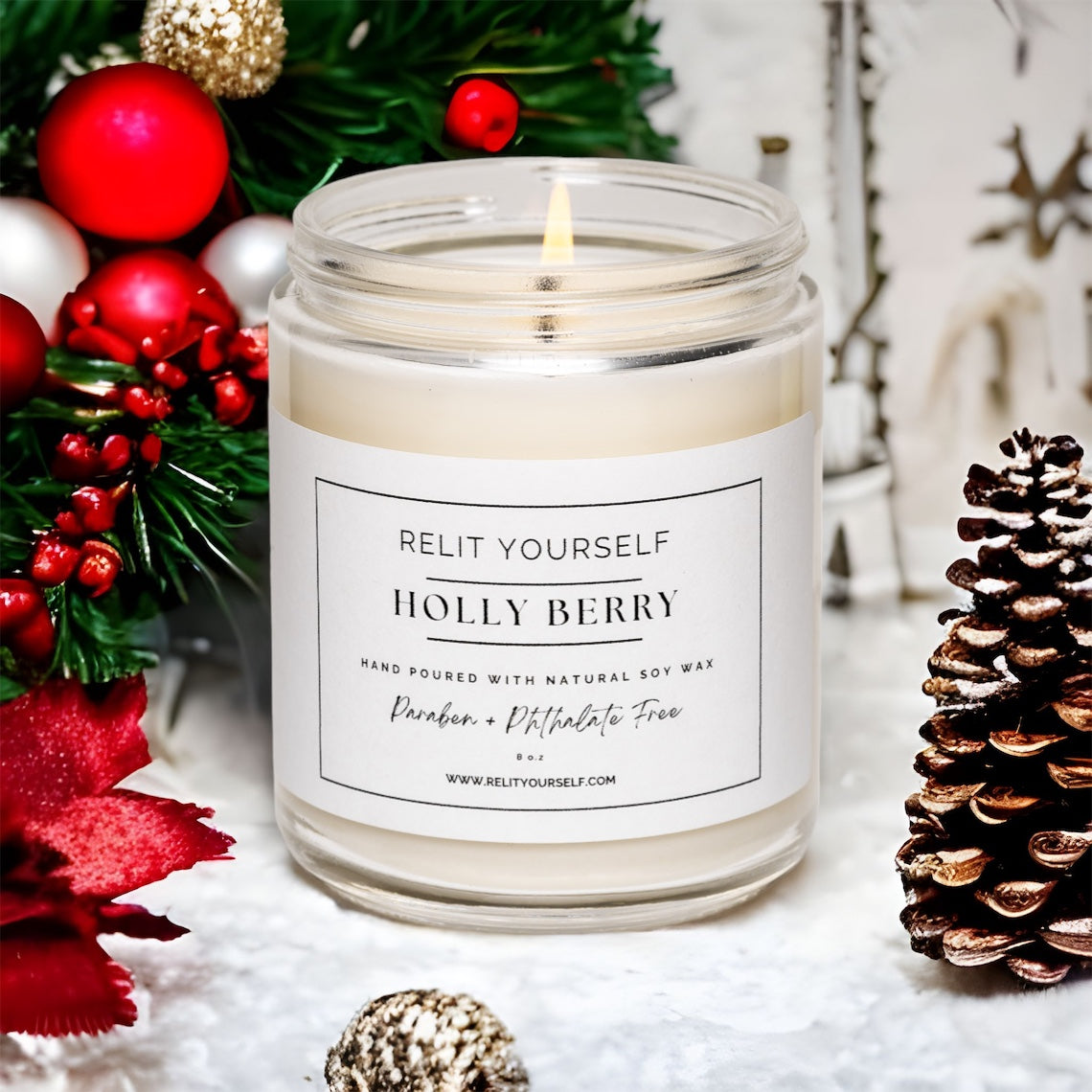 Candle labeled 'Holly Berry' with Christmas decorations in the background
